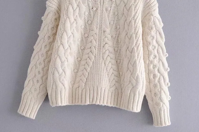 SWEATER WITH POMPOMS