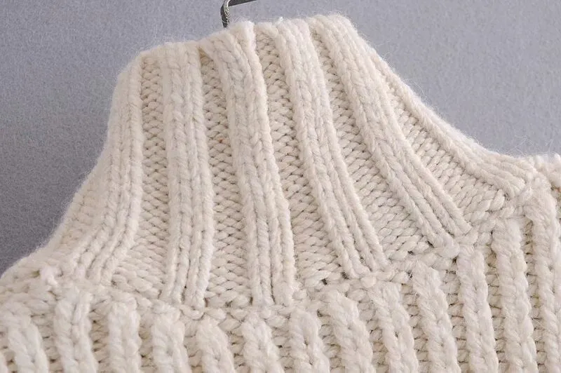 SWEATER WITH POMPOMS