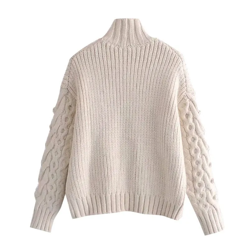 SWEATER WITH POMPOMS