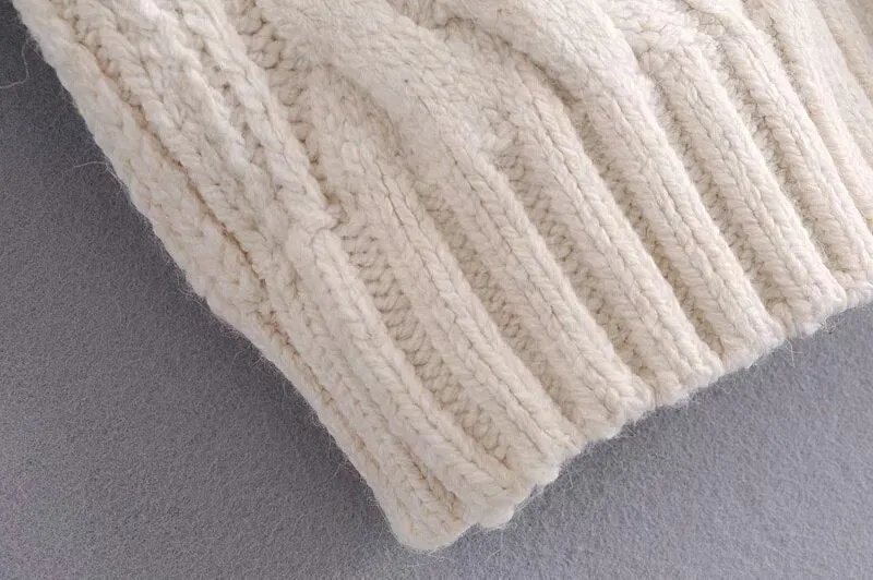 SWEATER WITH POMPOMS
